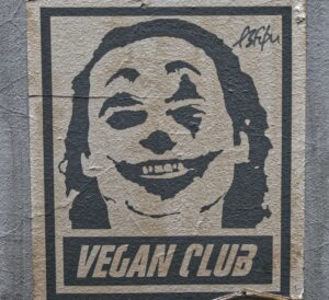 Image of a graffiti poster showing Joaquin Phoenix' Joker with the sub headline "Vegan Club"